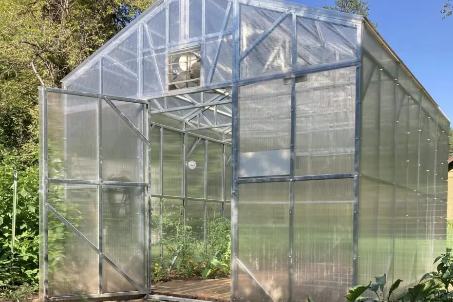 Exterior view of a B&T Manufacturing steel-framed greenhouse