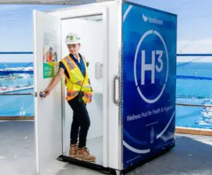 Female worker entering an H³ Wellness Pod
