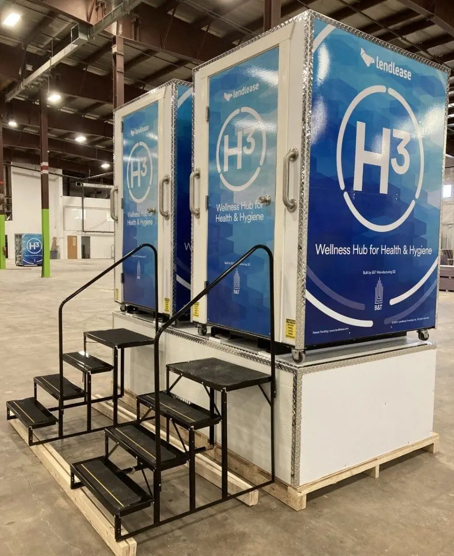 H³ Wellness Pods on stands with staircases leading up to the H³ Wellness Pods