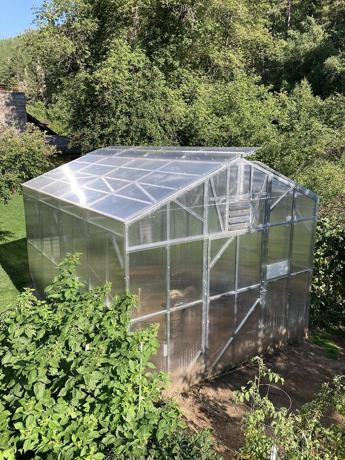 Angled high view of a steel frame greenhouse