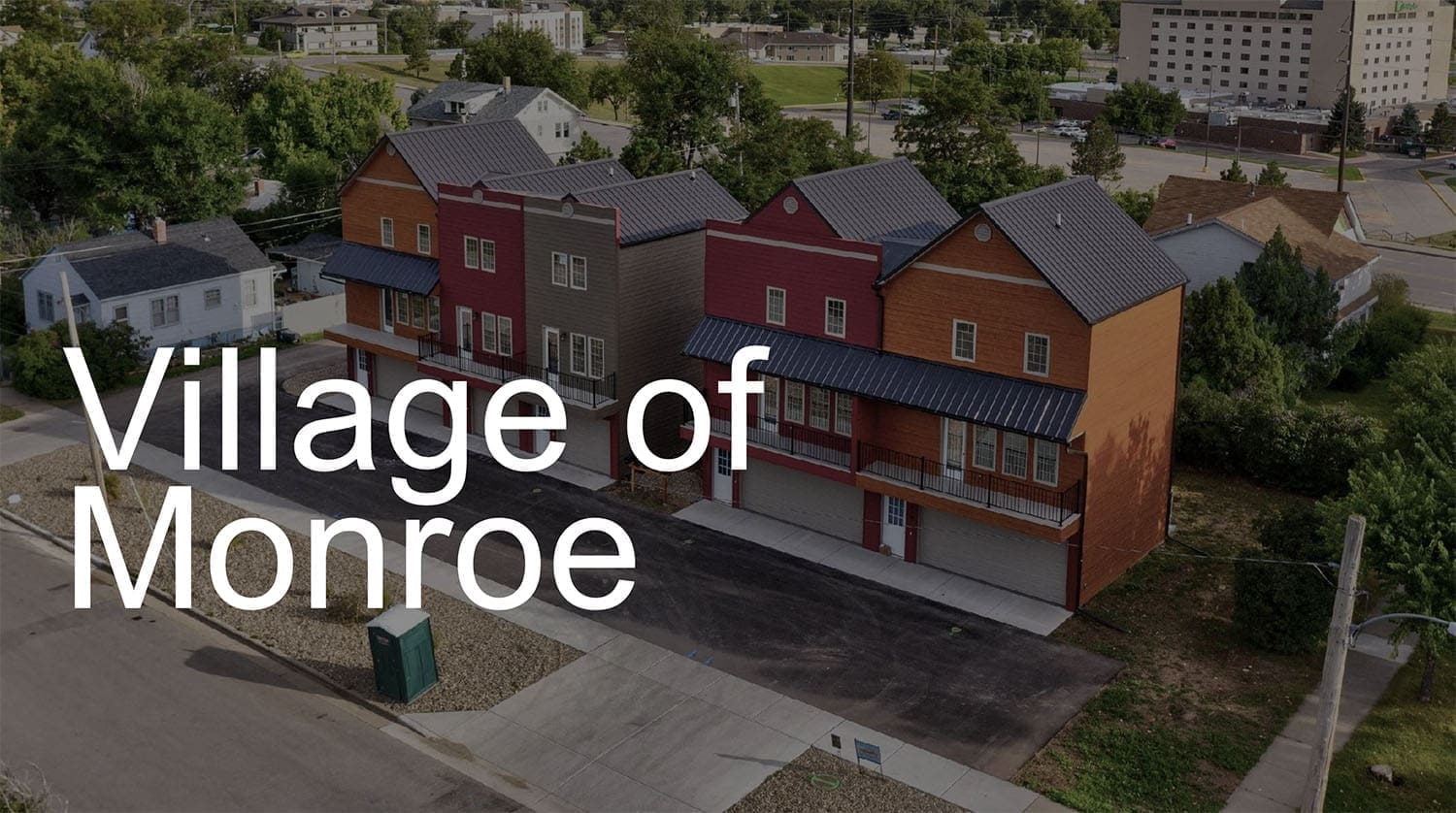 Angled high shot of the buildings of Village of Monroe