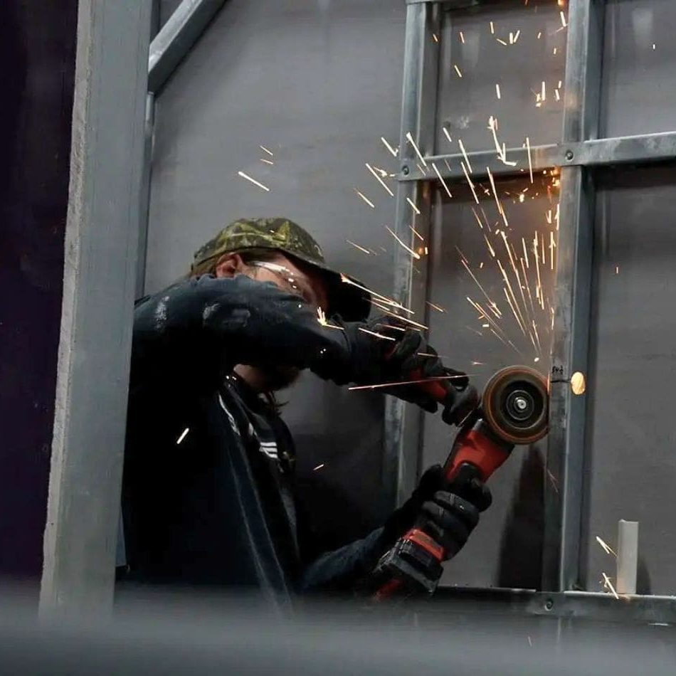 B&T worker working on putting together a steel frame B&T worker working on putting together a steel frame